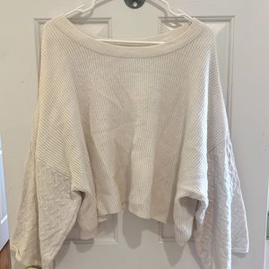White sweater with detailed wide sleeves